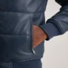 Hero shot of jacket showcasing the rich blue hue in daylight